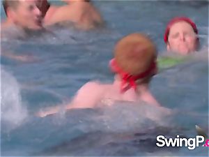 horny redheads have fun with different bare-chested chicks by the pool